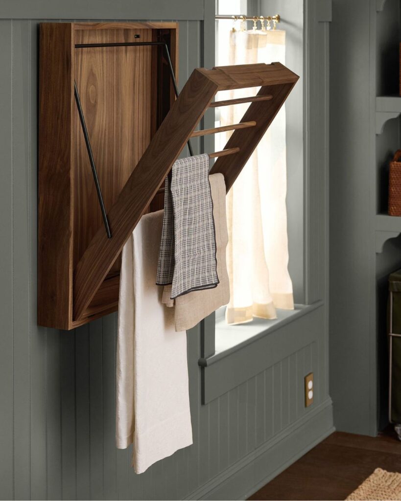 Functional mudroom bench detail with woven baskets, leather totes, and warm wood accents for custom home organization.